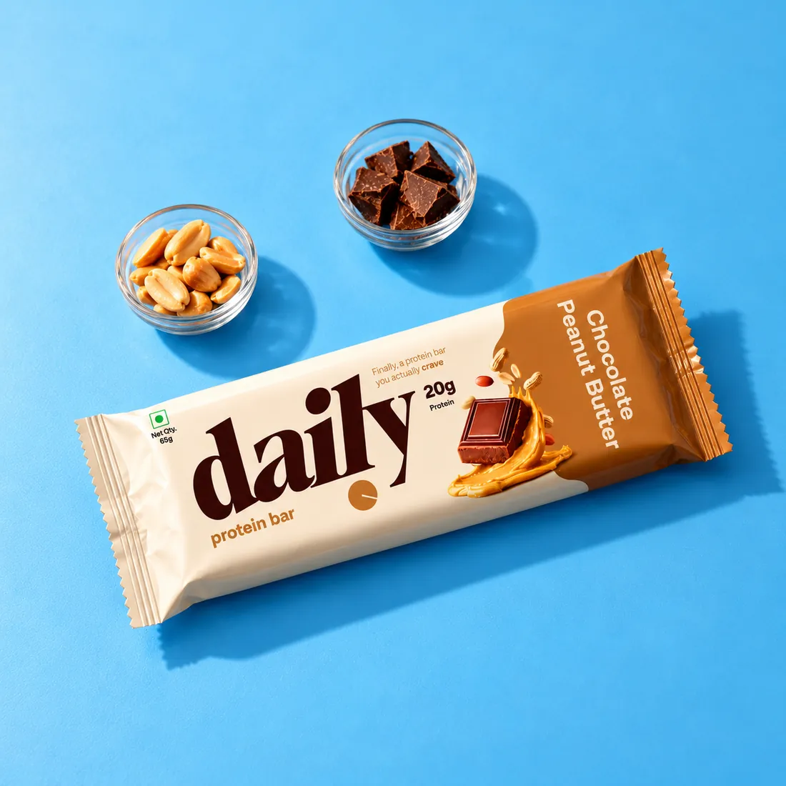 Chocolate Peanut Butter bar with bowls of peanuts and chocolate