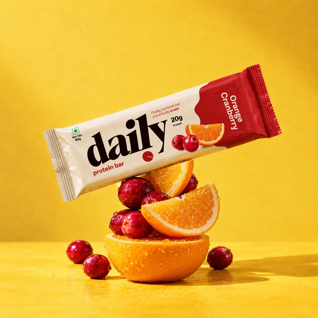 Orange Cranberry bar balanced on fresh orange and cranberries